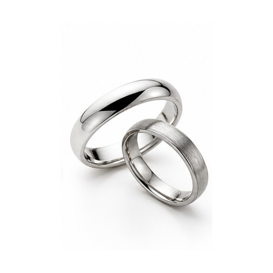 Silver rings arranged for review on a white surface